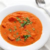 Butter Chicken · Boneless chicken chunks cooked in tandoor and mixed with mild tomato based sauce with almond...