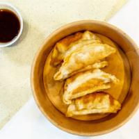 Gyoza (6 Pieces) · Deep-fried Pork and veggies dumplings.