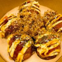 Takoyaki (6 Pieces) · Deep fried balll-shaped flour filled with diced Octopus; topped with Eel sauce, Mayo, Bonito...