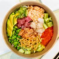 Rainbow Bowl · Ahi Tuna, Salmon, White Tuna, Edamame, Cucumber, Avocado, Crab salad, Masago, topped with gr...