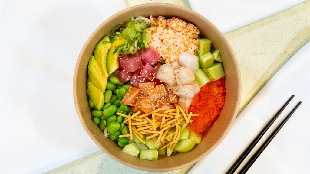 Rainbow Bowl · Ahi Tuna, Salmon, White Tuna, Edamame, Cucumber, Avocado, Crab salad, Masago, topped with green onions, chow mein noodles, sesame seeds, and Japanese Citrus sauce