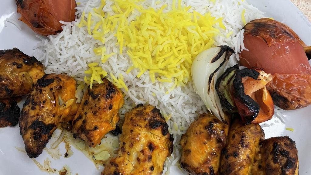 (C5). Chicken Barg · Grilled marinated pounded chicken breast served with grilled tomato, Bell pepper, onion & imported basmati rice topped with saffron