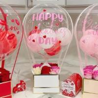 Hot Air Balloon · A basket arranged with roses and/or chocolate covered strawberries and a Clear round balloon...