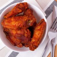 Wings · Deep fried chicken wings tossed in one of our signature sauces and served with celery and ca...