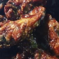 Jerk Wings · Six piece party wings dipped in our homemade jerk sauce.
