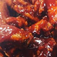 Sweet & Sour Wings · Six piece party wings dipped in our homemade sweet and sour  sauce.