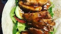 Jerk Chicken Wrap · Lumped grilled chicken breast marinated in jerk spices and sauce, folded into a buttery wrap...
