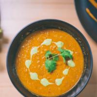 Winter Soup · Vegan. Sweet potato, lentils, tomato broth, green chilies, onion, garlic, ginger, lemon yogu...