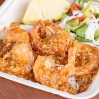 Pineapple Garlic Shrimp · Sauteed in sweet and tangy pineapple garlic sauce. Served over rice, side salad and 2 pineap...