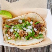 Carnitas Lunch · Pulled pork, diced onion, cilantro, served with lime wedge.