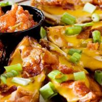 Bull Skins · Potato skins topped with queso cheese, bacon bits and diced green onions. Served with a side...