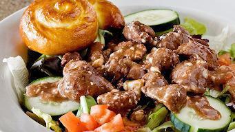 Tender Tips Salad · Sauteed tenderloin tips over a bed of fresh romaine with diced tomatoes, cucumbers, bleu che...
