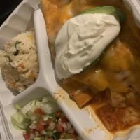 Enchiladas Super De Pollo · Corn tortilla stuffed with tender chicken topped with enchilada sauce, melted cheese, garnis...
