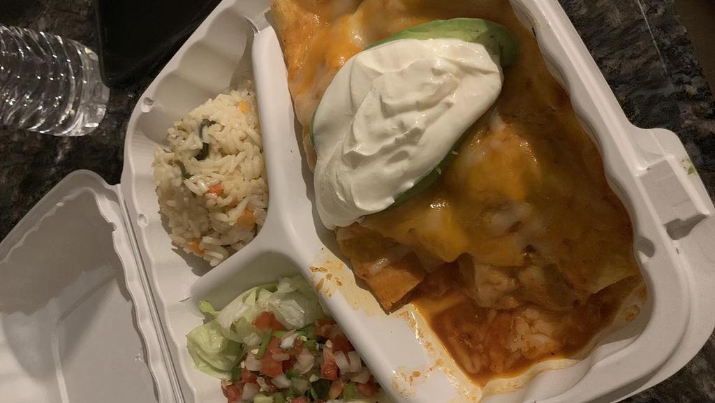 Enchiladas Super De Pollo · Corn tortilla stuffed with tender chicken topped with enchilada sauce, melted cheese, garnished with sliced avocados and sour cream, served with rice and beans.