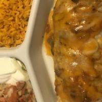 Chicken Burrito · Shredded chicken in a flour tortilla topped with fresh enchilada sauce and melted cheese gar...