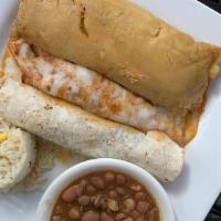 Tex-Mex Platter · Chicken tamale, chicken enchilada covered with melted cheese, and taco al carbon, served wit...