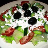 Greek Salad · Zesty combination of feta cheese, black olives, lettuce, tomato, cucumber and bell peppers.
