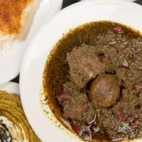 Ghormeh Sabzi · Parsley, leek, spinach and herbs sautéed and stewed with beef, served with steamed basmati r...