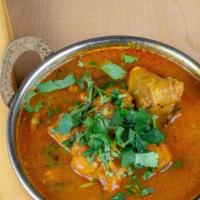 Chicken Curry · Boneless chicken pieces cooked in a traditional sauce.