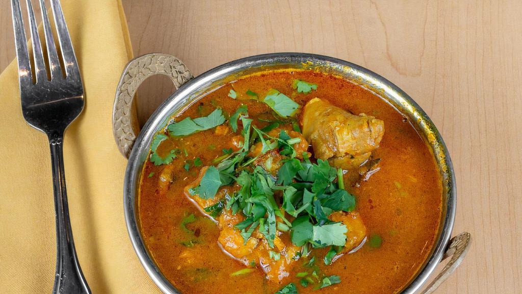 Chicken Curry · Boneless chicken pieces cooked in a traditional sauce.