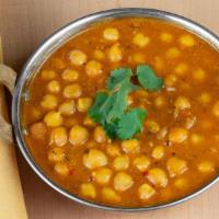 Chana Masala · A delicious chickpeas curry cooked in a special blend of Indian spices.