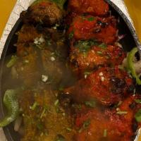 Tandoori Platter · Three pieces of boneless chicken tikka, three pieces of lamb boti, one piece of tandoori chi...