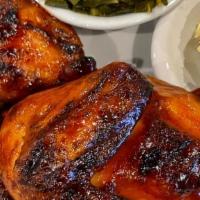 Bbq Half Chicken · Succulent smoked BBQ 1/2 chicken. Choice of any two 4 oz sides.