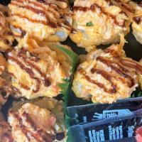 Spicy Crabmeat Crunch · Deep fried tempura sushi rolls with spicy crabmeat on top.