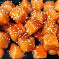 Sesame Tofu · Deep fried tofu chunk to its crispness and top off with General Tso's Sauce.