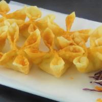 Crab Delight · Deep fried won-ton wrappers filled with crab meat, imitation crab and cream cheese and serve...