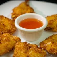 Coconut Prawns · Six golden prawns deep fried in coconut tempura batter and served with our sweet and sour sa...