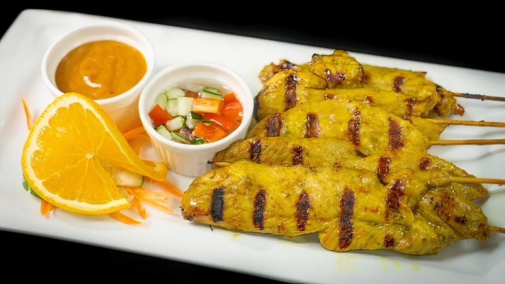 Chicken Satay · Marinated in a mixture of herbs and grilled. Served with peanut sauce and cucumber salad.