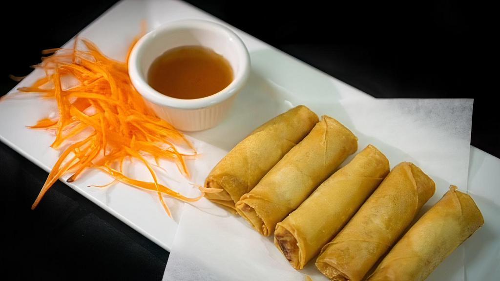 Crispy Spring Rolls · Egg roll wrapped with mixed vegetables and deep fried and served with plum sauce.
