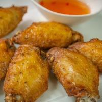 Chicken Wing · Marinated chicken wings in our ingredients then deep fried and served with sweet and sour sa...