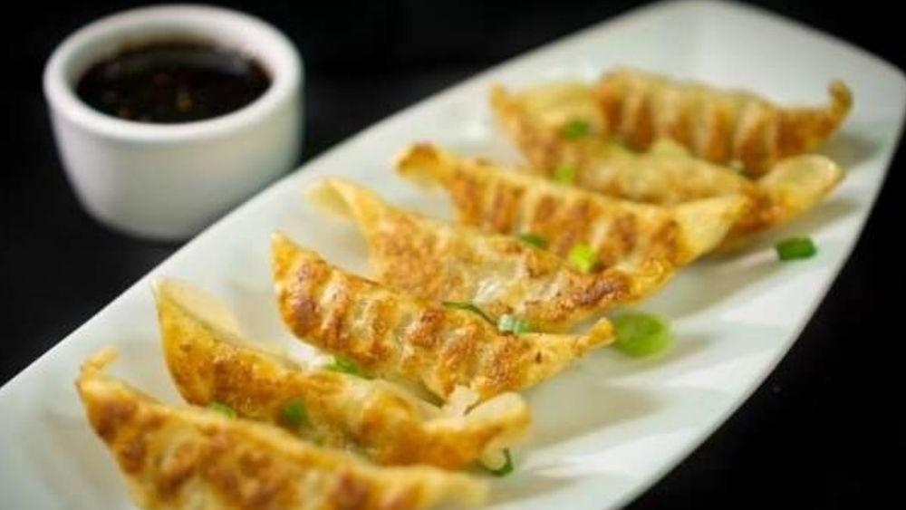 Gyoza Dumplings · Pan fried gyoza with mixed vegetables and chicken. Served with dumpling sauce.