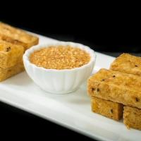 Deep Fried Tofu · Crispy fried tofu served with sweet and sour sauce topped with ground peanuts.