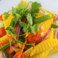 Mango Salad · Sliced mango mix with fish sauce, lime juice, red onion, green onion, cilantro, tomato and c...
