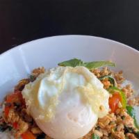 Kow Lhad Nha Gapow  · Stir fried minced meat with garlic, serrano, Thai basil, bell peppers over rice with fried egg