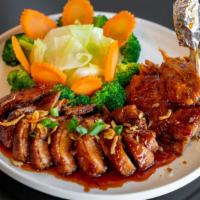 Roasted Duck In Red Curry Sauce · Spicy. Eggplant, bamboo shoots, tomatoes, pineapple, bell peppers, basil leaves, tropical fr...