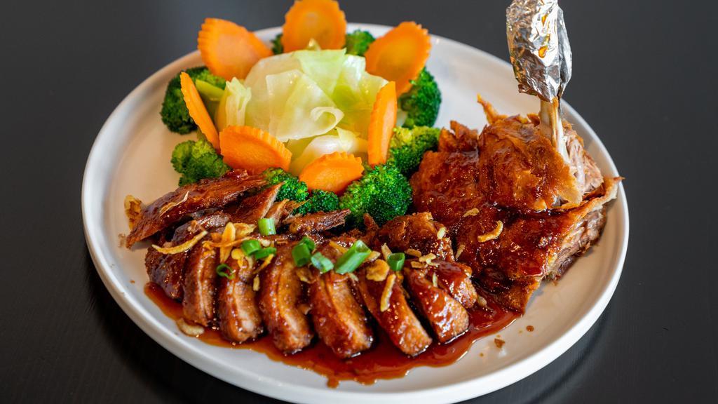 Roasted Duck With Tamarind Sauce · Boneless roasted duck topped with tamarind sauce and served with steamed vegetables.