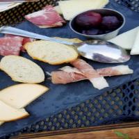 Charcuterie And Cheese Board · Chef's selection of cured meats and cheeses imported for Italy, Mediterranean olives, house ...