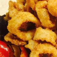 Calamari  · Lightly floured local calamari rings, citrus & cherry pepper aioli