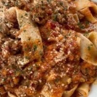 Bolognese · Beef, pork & veal ragu, fresh pappardelle, San Marzano tomato, parmigiana cream