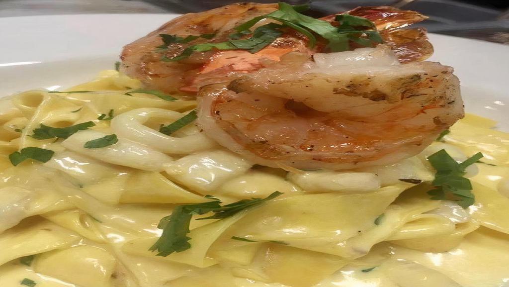 Seafood Pappardelle · Shrimp, scallops, mussels & calamari in a creamy lobster & parmesan sauce