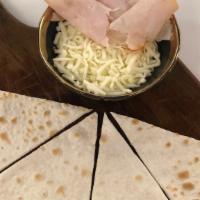 Turkey & Cheese · Thinly sliced turkey and Mozzarella cheese on an authentic Lebanese flatbread (sajj) and bak...