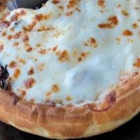 Veggie And Soujok Pizza Pot Pie · Upside down pizza with toppings within a pot pie. Toppings include: soujok (spiced beef saus...