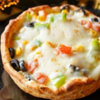 Veggiepizza Pot Pie · Upside down pizza with toppings within a pot pie. Toppings include: mushrooms, green bell pe...