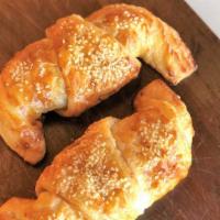 Zaatar Croissant  · A buttery, flaky crescent-shaped bread roll filled with zaatar (thyme, sesame, olive oil and...
