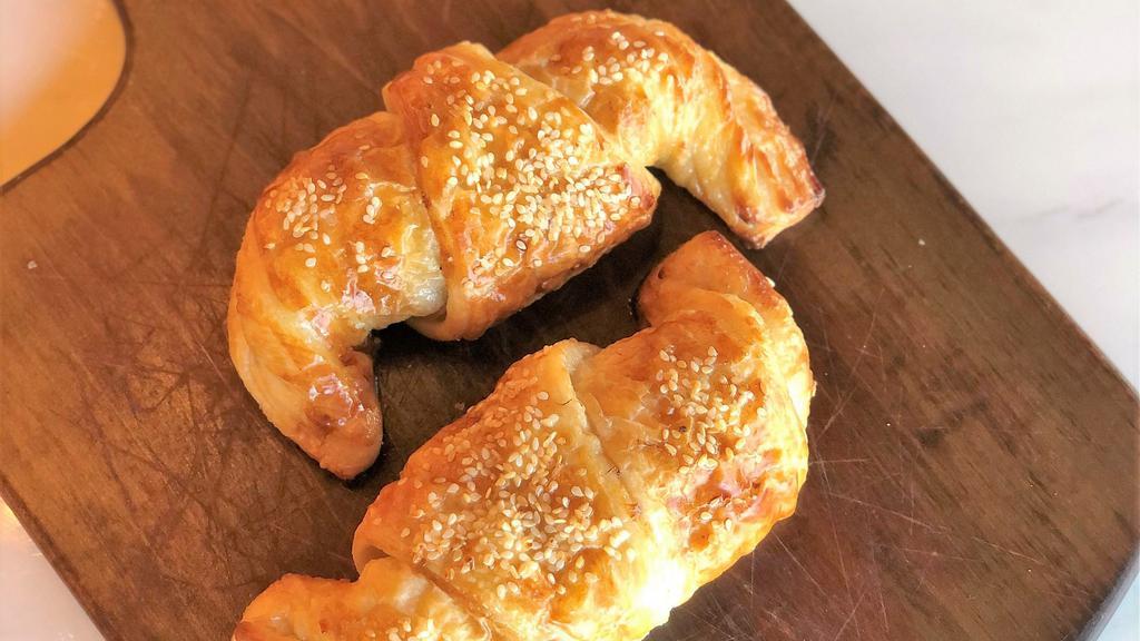 Zaatar Croissant  · A buttery, flaky crescent-shaped bread roll filled with zaatar (thyme, sesame, olive oil and sumac).