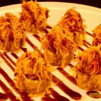 Volcano Roll · Deep fried spicy tuna, spicy salmon,spicy yellowtail and cream cheese inside, spicy crab ,ee...